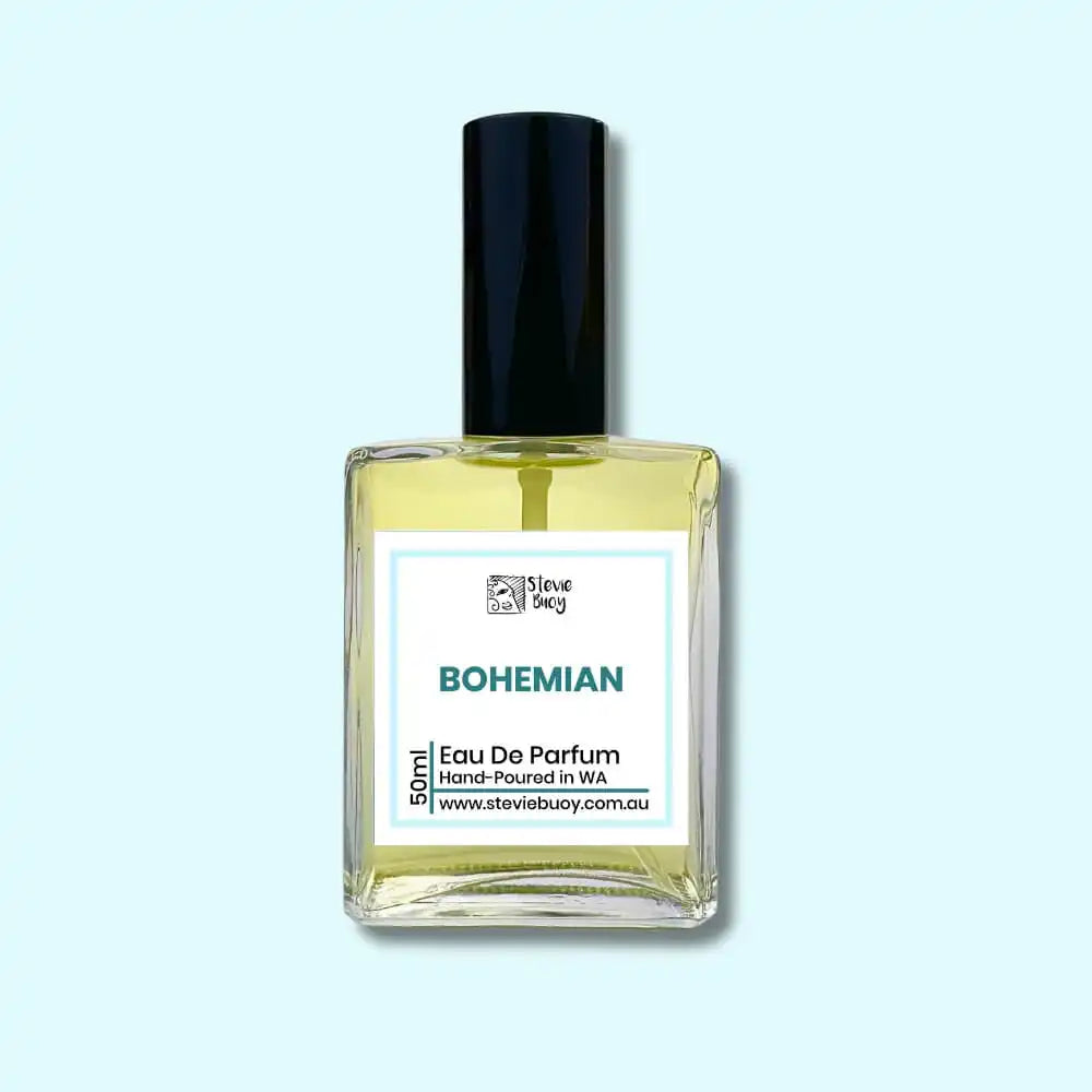 A clear glass bottle of ’Bohemian’ eau de parfum with a black cap.