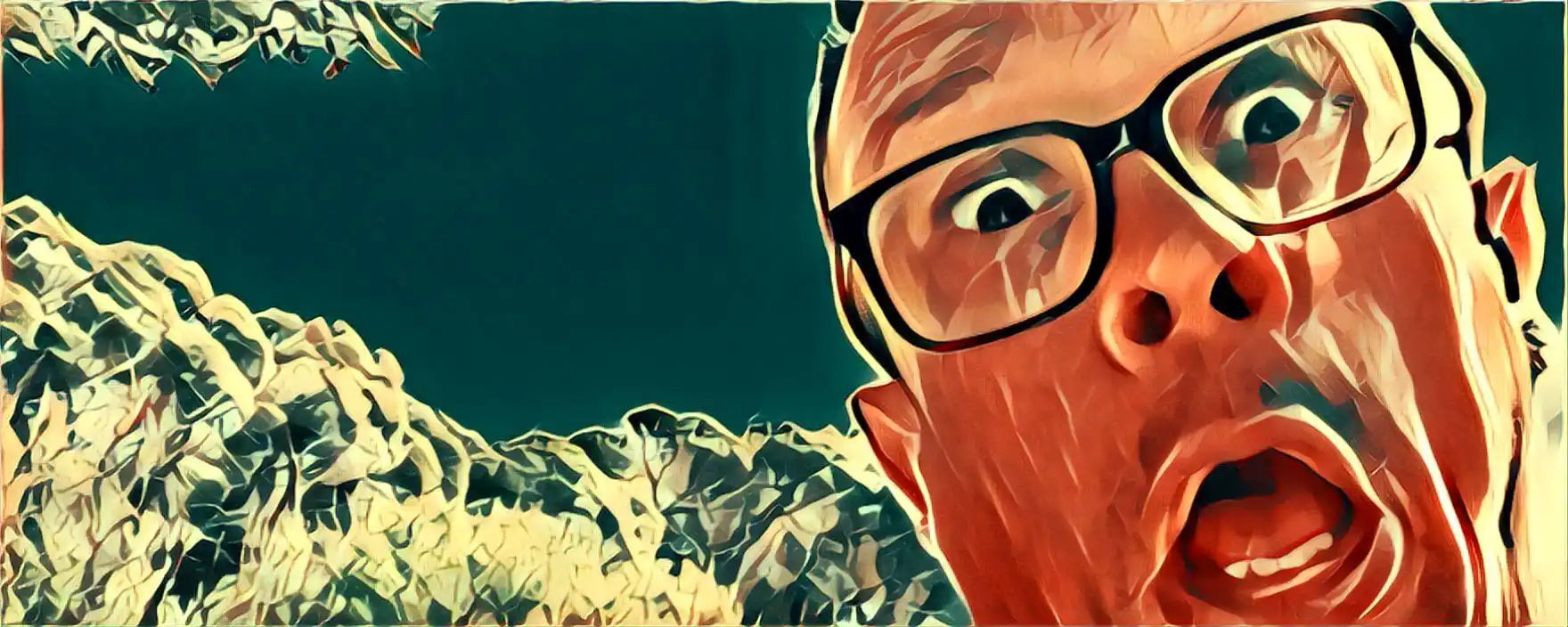 A close-up artistic portrait of someone wearing glasses making an exaggerated surprised expression.