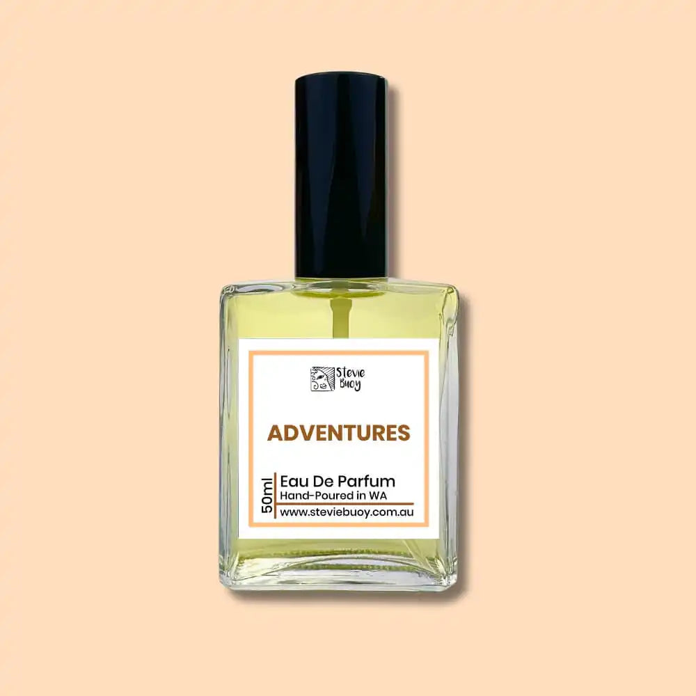 A glass bottle of ’Adventures’ eau de parfum with a black cap.