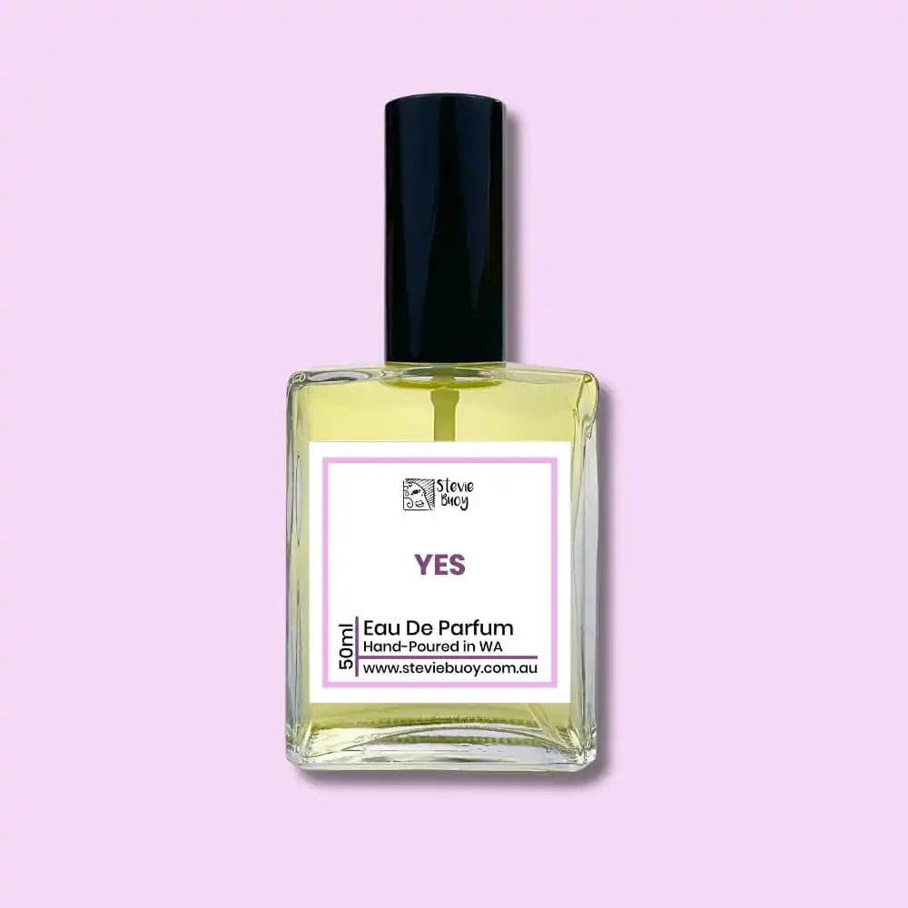 A glass bottle of ’Yes’ eau de parfum with a black cap.